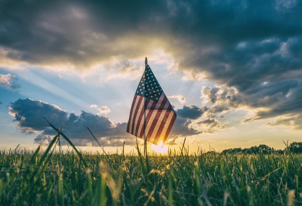 US flag over field