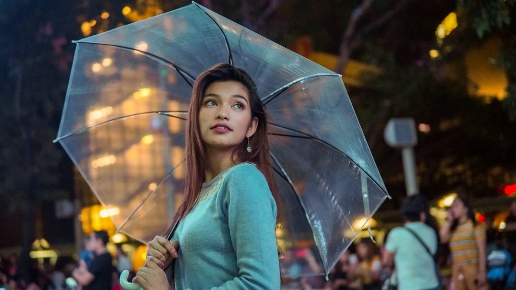 woman holding umbrella