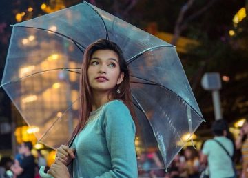 woman holding umbrella