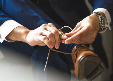 Man tying shoes
