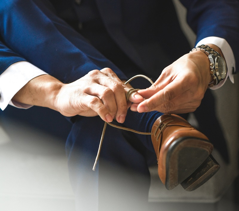 Man tying shoes