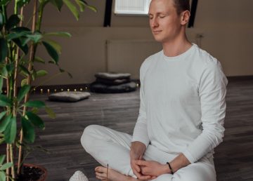 man sitting cross-legged