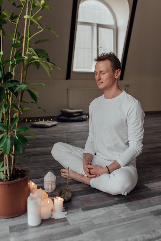 man sitting cross-legged