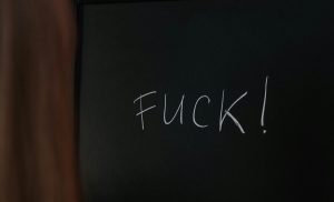 word Fuck on chalkboard