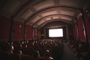 people watching a movie inside a theater